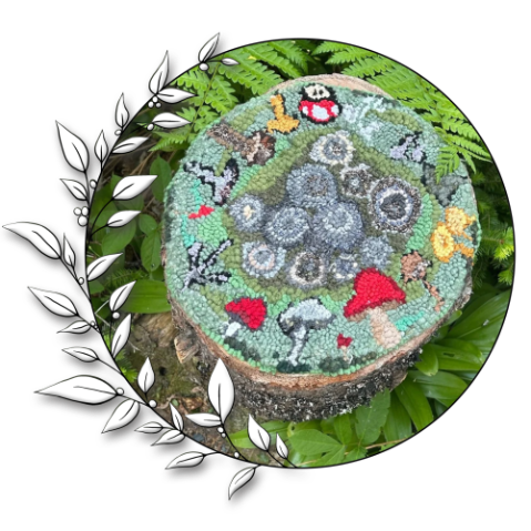 A hooked rug atop a stump depicting mushrooms and lichen